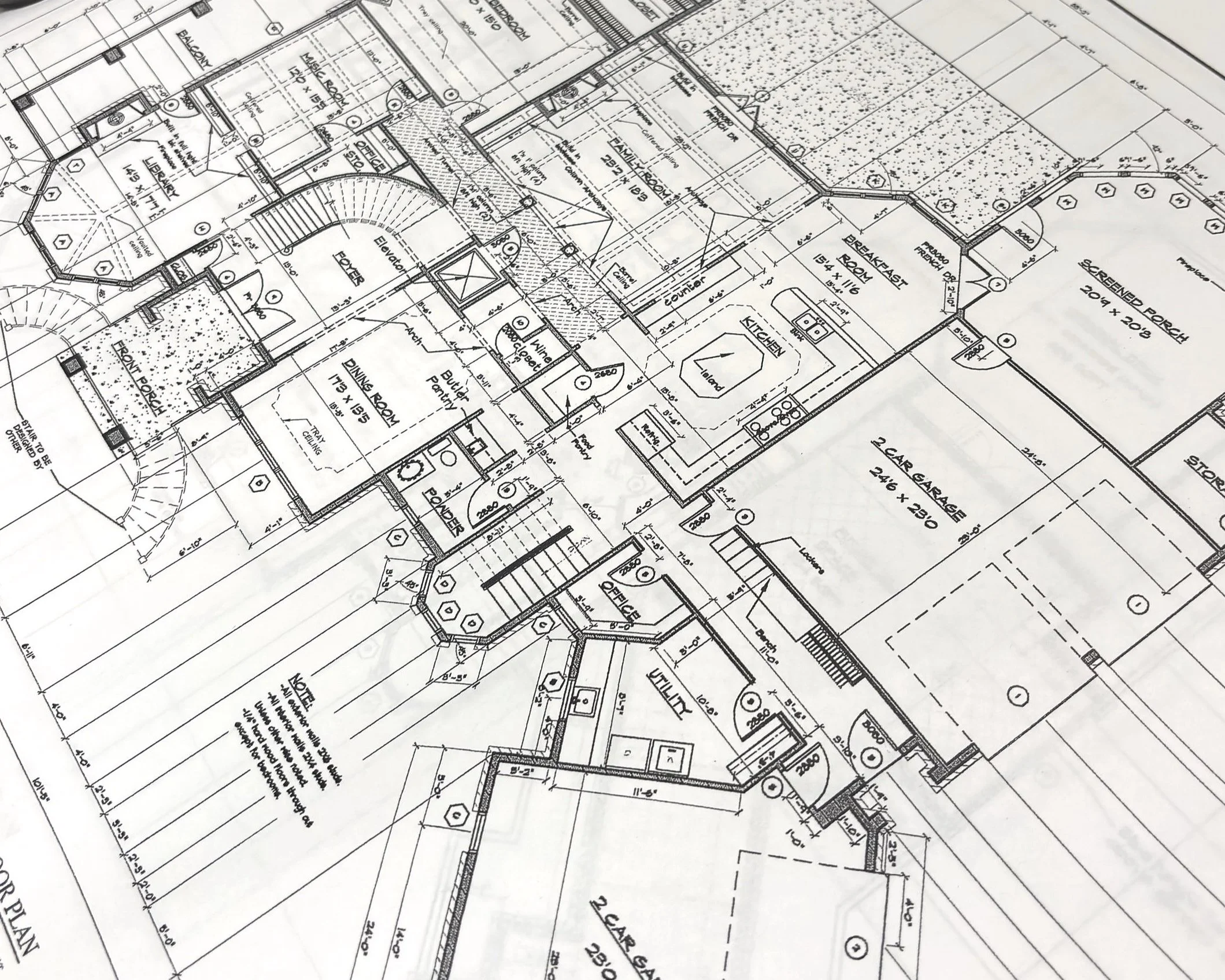 Architectural blueprint of a house floor plan with labeled rooms, measurements, and structural details.